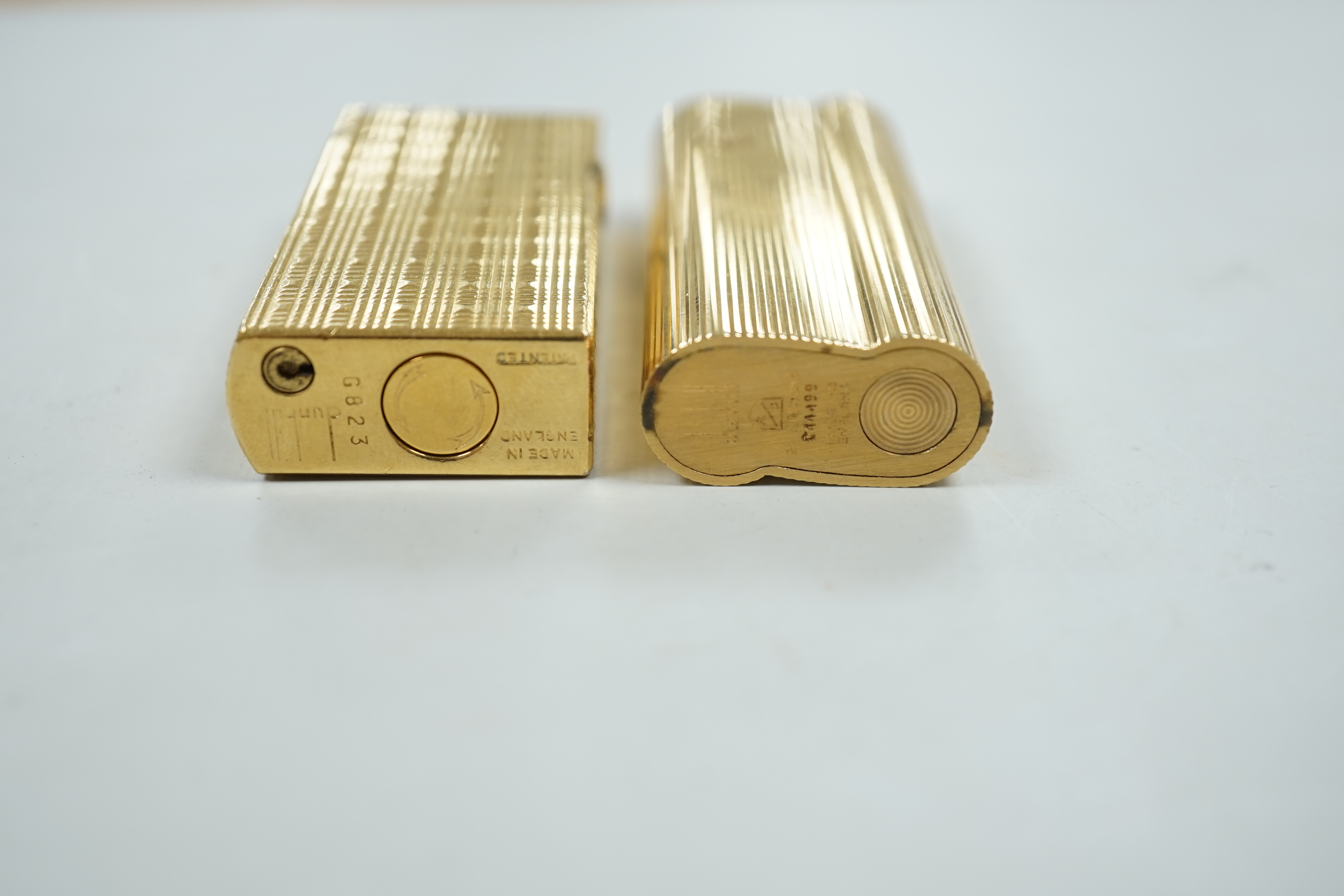 Two Dunhill lighters.